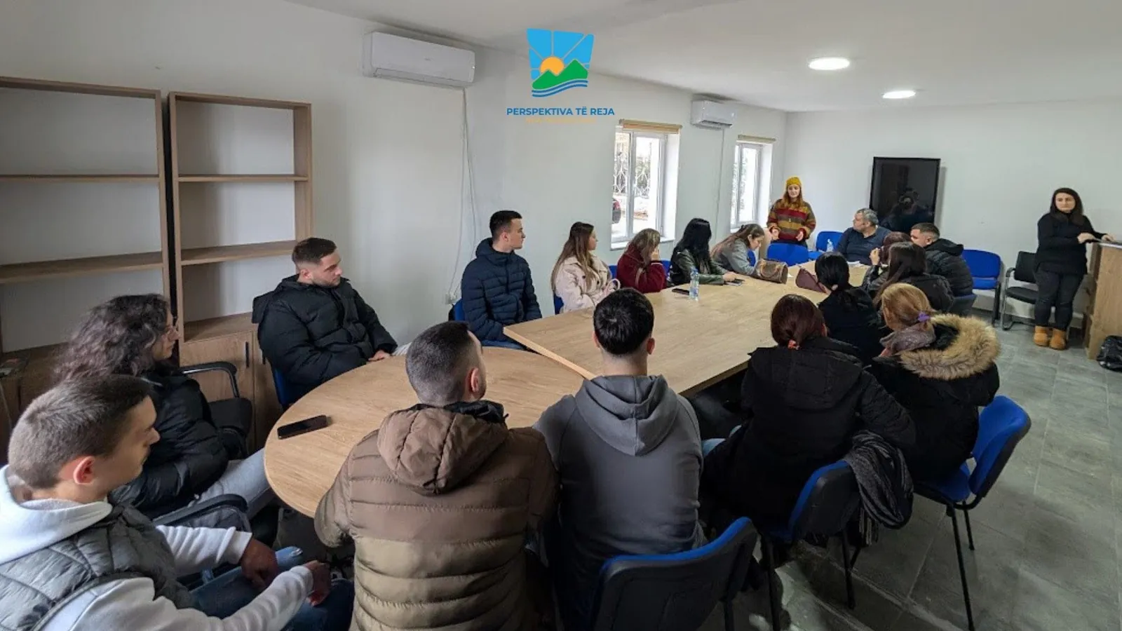 A New Perspectives working session with young participants around a meeting table